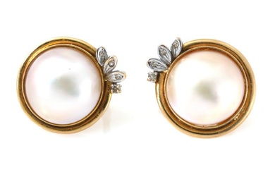 A pair of mabé pearl and diamond ear clips each set with...