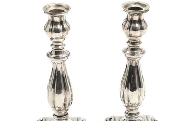 A pair of silver candlesticks. Unidentified marks, 19th century. Filled. H. 20...