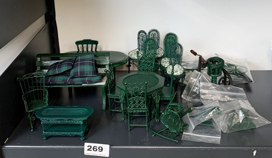 A quantity of dolls house green painted metal garden furniture, including a bicycle.