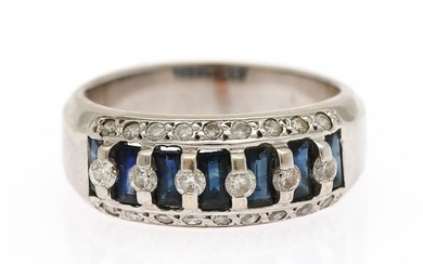 A sapphire and diamond ring set with seven baguette-cut sapphires and numerous brilliant-cut diamonds, mounted in 18k white gold. Size 55.