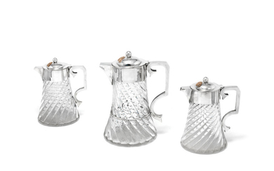 A set of three Victorian silver-mounted cordial jugs