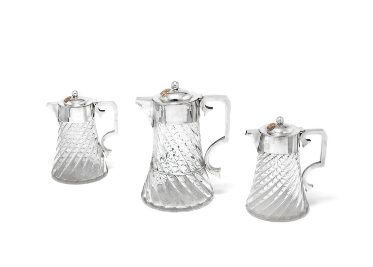 A set of three Victorian silver-mounted cordial jugs