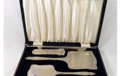 A silver backed dressing table set, comprised of a long hand...