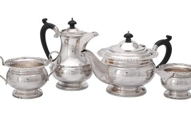 A silver circular four piece tea service by G. Bryan & Co.
