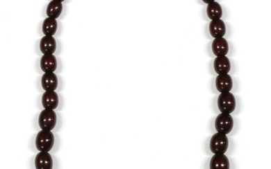 A single row graduated oval oxblood coloured Bakelite bead necklace