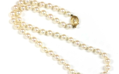 A single row uniform cultured pearl necklace with gold diamond clasp