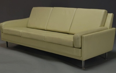A three seat cream leather sofa, c.1960, with six loose...
