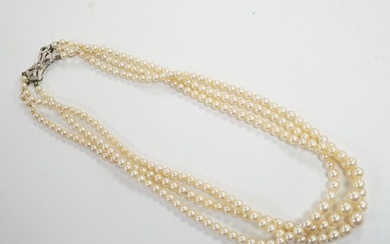 A triple strand graduated cultured pearl choker necklace, wi...