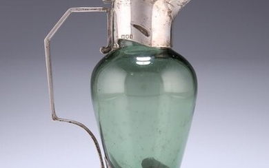 AN ART NOUVEAU SILVER-MOUNTED GREEN-GLASS CLARET JUG