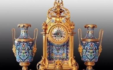 AN IMPOSING FRENCH CHAMPLEVE ENAMEL CLOCK SET