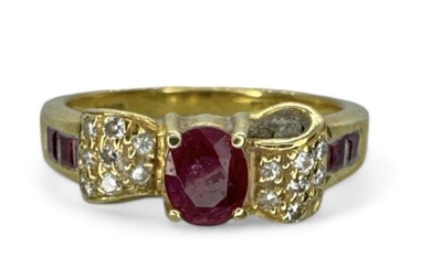 An 18ct gold diamond and ruby set bow ring. Featuring...