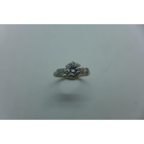 An 18ct white gold and platinum solitaire diamond ring, the ...