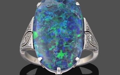 An Art Deco Black Opal and Diamond Ring, the oval...