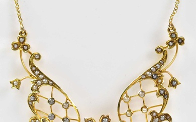 An Edwardian 15ct gold necklace set with seed pearls on...