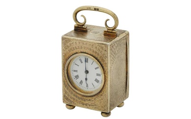An Edwardian sterling silver gilt cased travelling time piece or carriage clock, London 1909 by Drew and Sons