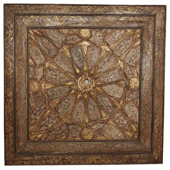 An Ottoman wooden painted panel, probably from a ceiling, Turkey, 19th century, comprising wooden panels set in a geometric stellar composition into square frame, each panel painted with floral details with red highlights and black outlines, with...