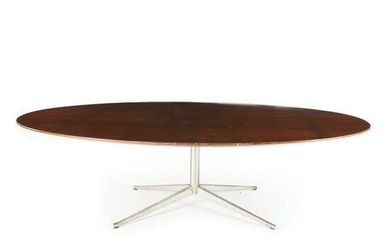 An oval top wood table on a chrome base, '70s