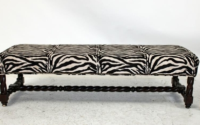Backless bench with zebra print upholstery