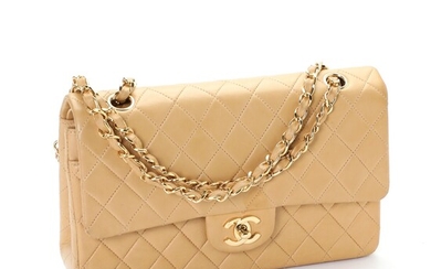NOT SOLD. Chanel: A "Classic Double Flap" bag made of beige lamb skin with gold...