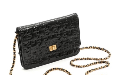 SOLD. Chanel: A black quilted patent leather puzzle WOC shoulder bag with golden hardware. 13 x 19 cm. – Bruun Rasmussen Auctioneers of Fine Art