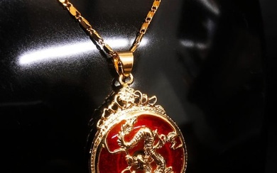 Chinese Carved Red Jade In Gold Dragon Mount