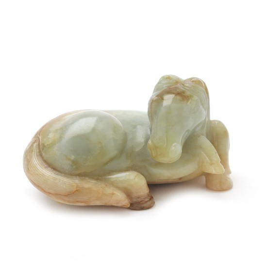 Chinese greenish-russet jade in shape of a recumbent horse. Qing/Republic. Weight 165 gr. L. 8 cm.