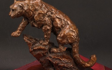 Contemporary School, a patinated bronze, leopard on a rock, ...