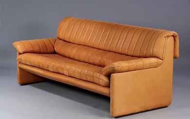 DE SEDE. Vintage three-seater sofa, model DS 86. Upholstered in cognac patinated natural leather. Made...