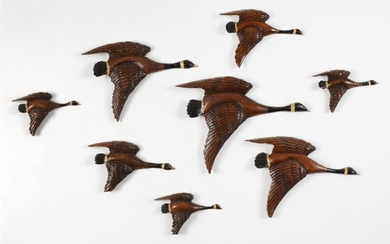 EIGHT CARVED WOODEN FLYING CANADA GEESE PLAQUES Maker unknown. In flying form. Lengths from 5" to 11".