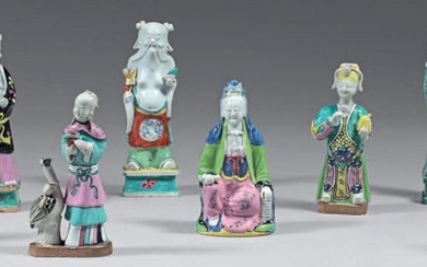 Eight Chinese porcelain statuettes. Jiaging. Decorated with the enamels of the Rose Family, representing: a woman with a crane, two figures with yellow headdresses, a guanyin, three immortals, a young man dressed in a pale blue dress, small lacks...