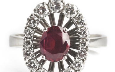 SOLD. Georg Jensen & Wendel: A ruby and diamond ring set with an oval-cut ruby encircled by numerous brilliant-cut diamonds, mounted in 18k white gold. – Bruun Rasmussen Auctioneers of Fine Art