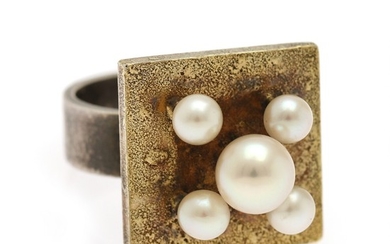 Hans Hansen: A pearl ring set with five cultured pearls, mounted in partly gilded sterling silver. Top hight app. 16 mm. Size 52.