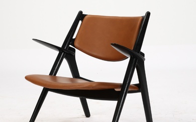 Hans J. Wegner. Sawbuck armchair, model CH-28, cognac colored aniline leather