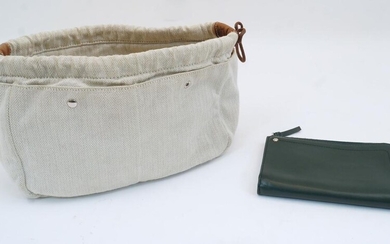 Hermes: a Fourbi 25 natural canvas and brown leather drawstring pouch bag, with Hermes label to the interior zipped compartment, approximately 20cm x 30cm, together with a Connolly Hex half medium wallet in dark green leather, silver makers stamp...