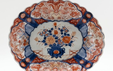 JAPANESE IMARI PORCELAIN SERVING DISH Fluted oval, with decoration of a flower basket surrounded by birds and flowers. Length 12".