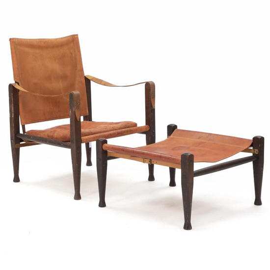 SOLD. Kaare Klint: "Safari chair". An easy chair and stool with smoked oak frame. Seat and back stretched with reddish brown leather. (2) – Bruun Rasmussen Auctioneers of Fine Art