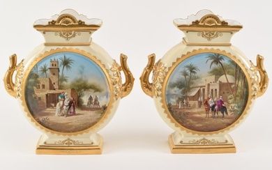 Large pair of Paris porcelain Orientalist decorated moon shape vases with gilt branch form handles.