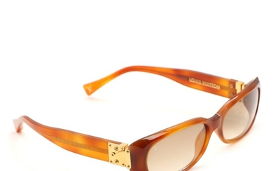 SOLD. Louis Vuitton: A pair of brown acetate sunglasses with golden hardware. Original case. –...