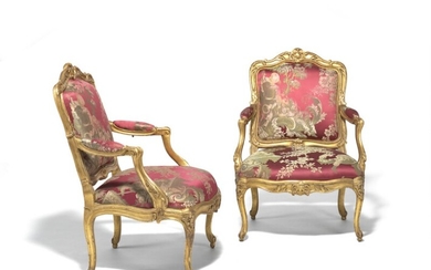 Mathieu de Bauve, master in 1754: A pair of Louis XV carved giltwood fauteuils à châssis, covered in a silk damask. Stamped 'BAUVE'. Paris, c. 1755. (2)