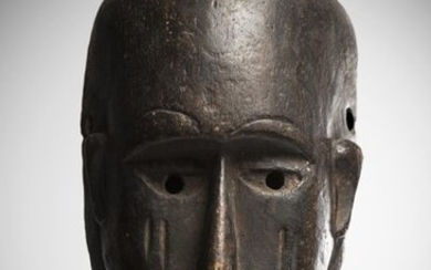 NIAMWEZI, Tanzania. Medium-heavy wooden mask with dark patina....