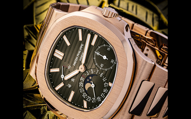 PATEK PHILIPPE. AN 18K PINK GOLD AUTOMATIC WRISTWATCH WITH POWER RESERVE, MOON PHASES, DATE AND BRACELET NAUTILUS MODEL, REF. 5712/1R-001, CIRCA 2022