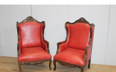 Pair of leather upholstered wingback armchairs in Italian st...