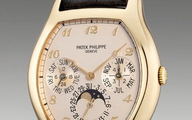 Patek Philippe, Ref. 5040 A rare, early and attractive yellow gold tonneau-shaped perpetual calendar wristwatch with moon phases, leap year, 24-hour indication, Breguet numerals, additional solid caseback, Certificate of Origin and presentation box