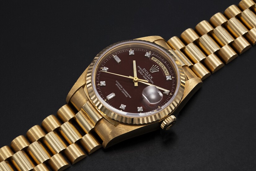 ROLEX, A GOLD OYSTER PERPETUAL DAY-DATE WITH “OXBLOOD STELLA DIAL”, REF. 18238