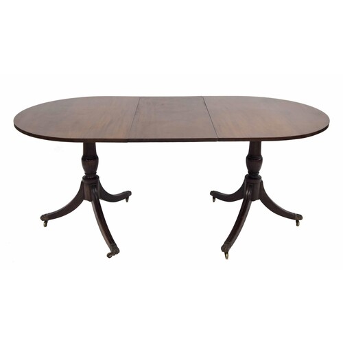 Regency style twin pedestal extending mahogany dining table,...