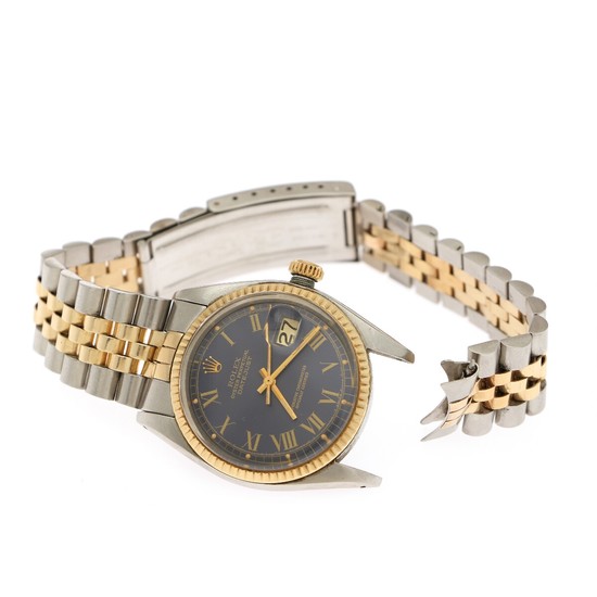 Rolex: A gentleman's wristwatch of 18k gold and steel. Model Datejust, ref. 1601. Mechanical movement with automatic winding, cal. 1570. 1977.
