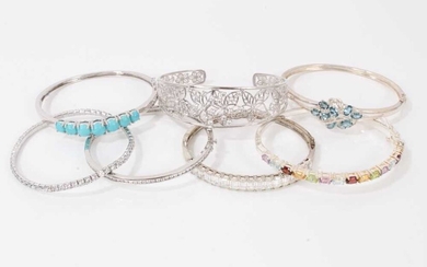 Seven contemporary silver paste and gem set bangles