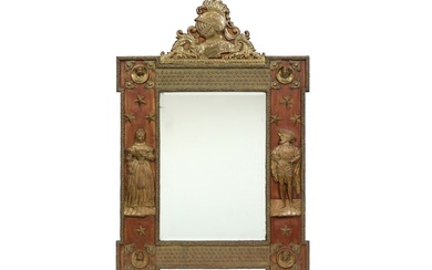 Spiegel met een antieke houten kader versierd met koperen motieven en figuren...