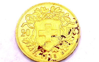 Suisse - Pièce de 20 francs suisse tête d'Helvetia en or jaune datant de 1935...