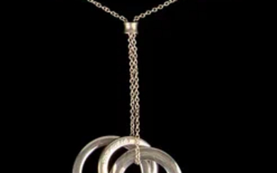 Intertwined ring pendant in sterling silver by Tiffany & Co.